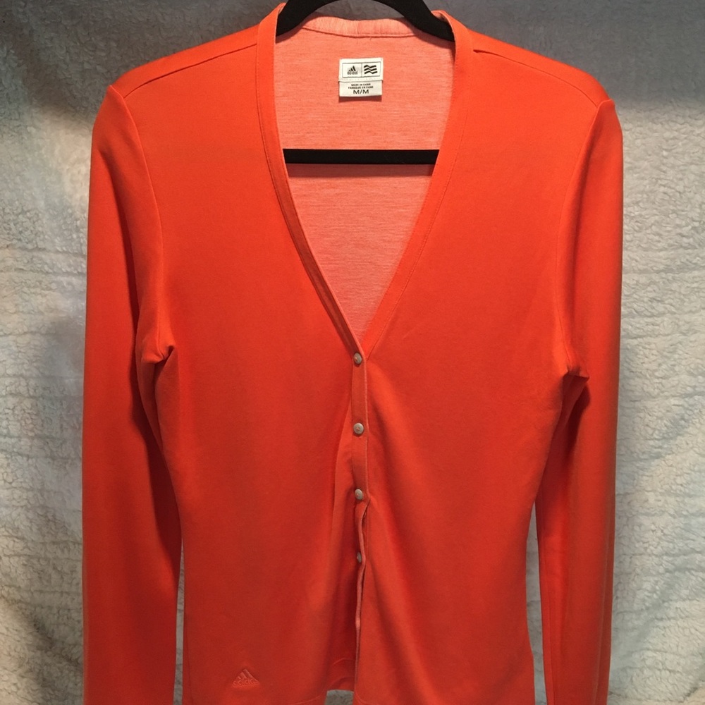 Adidas orange cardigan.